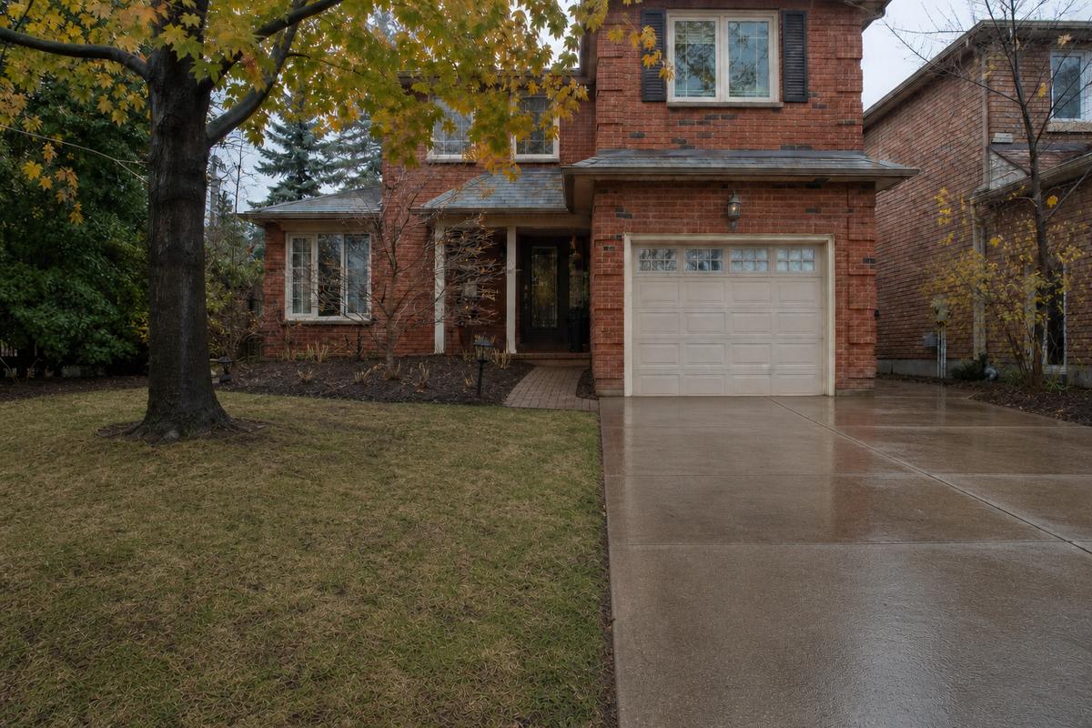 The same front yard and driveway after seasonal cleanup