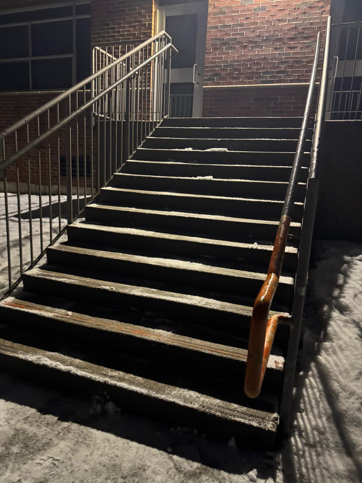 Commercial double doors with a cleared concrete landing