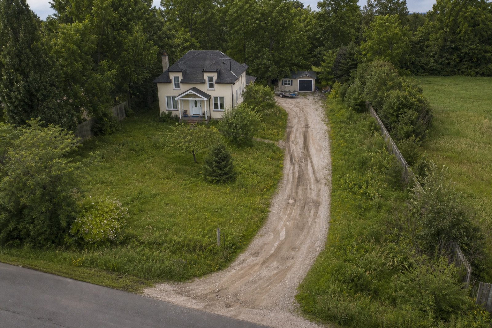 Before — lawn overgrown and needing maintenance
